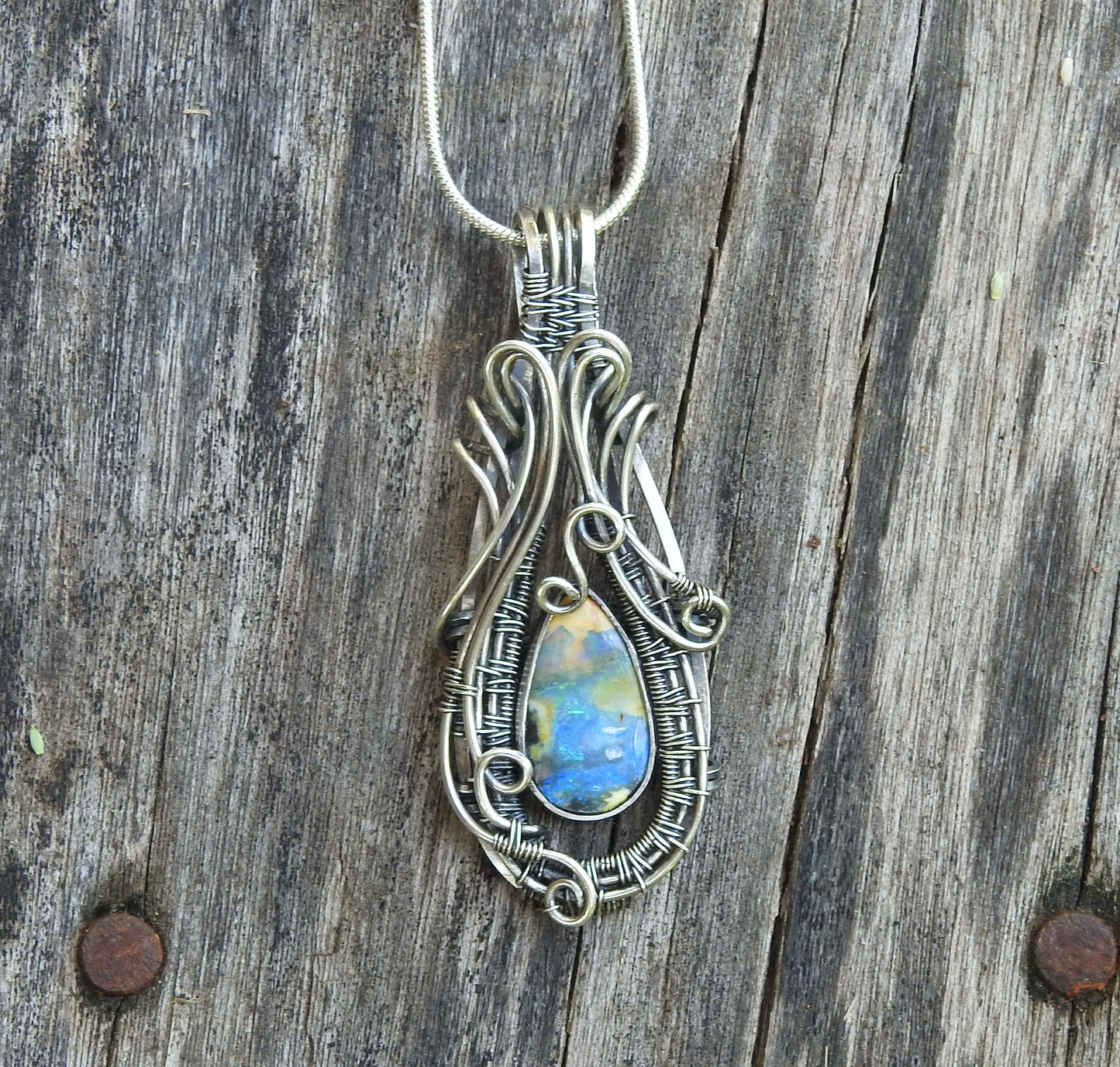 Australian Boulder opal handmade, wire wrap pendant.