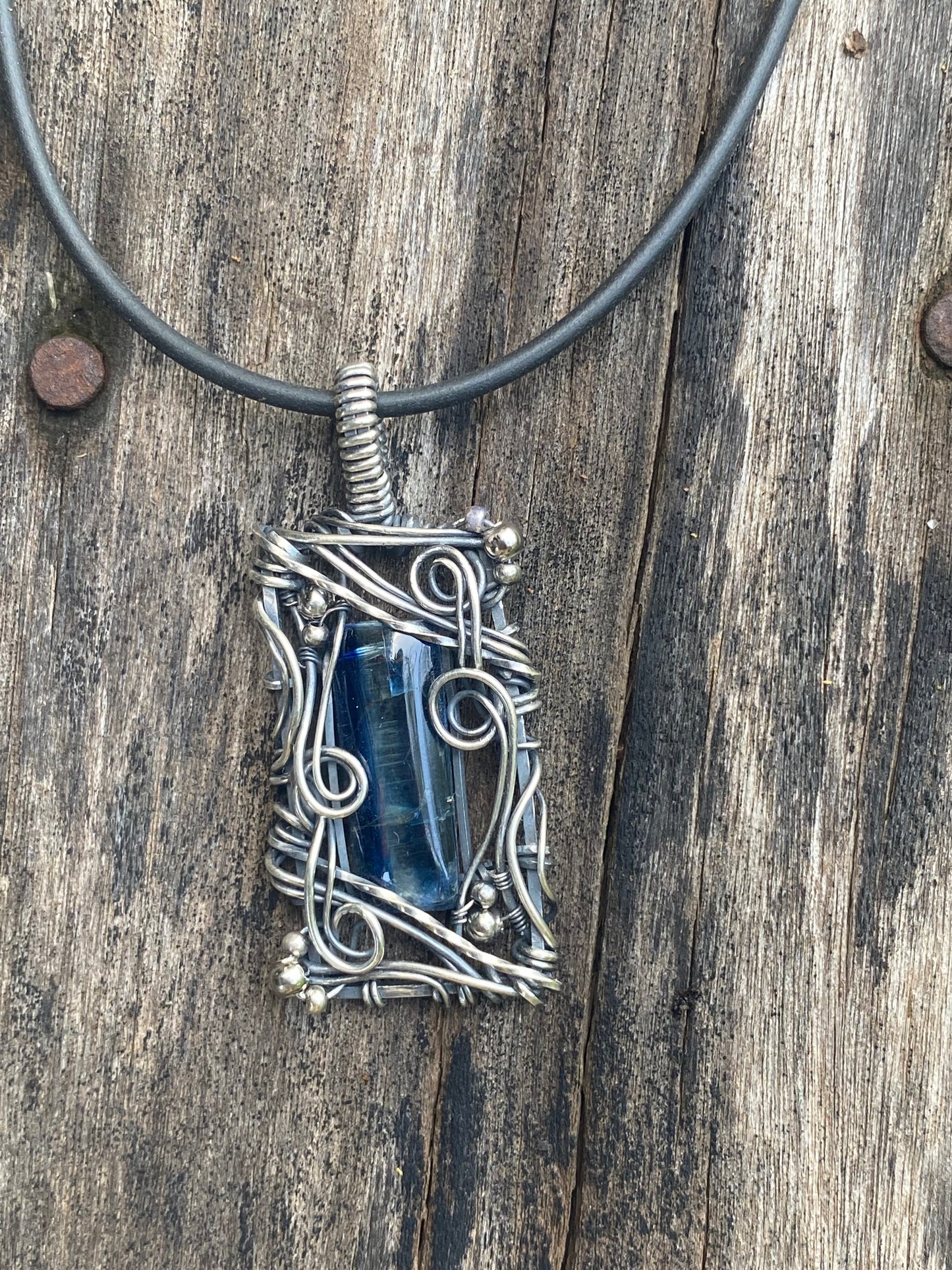 Blue Kyanite and Sterling Silver wire wrap pendant.