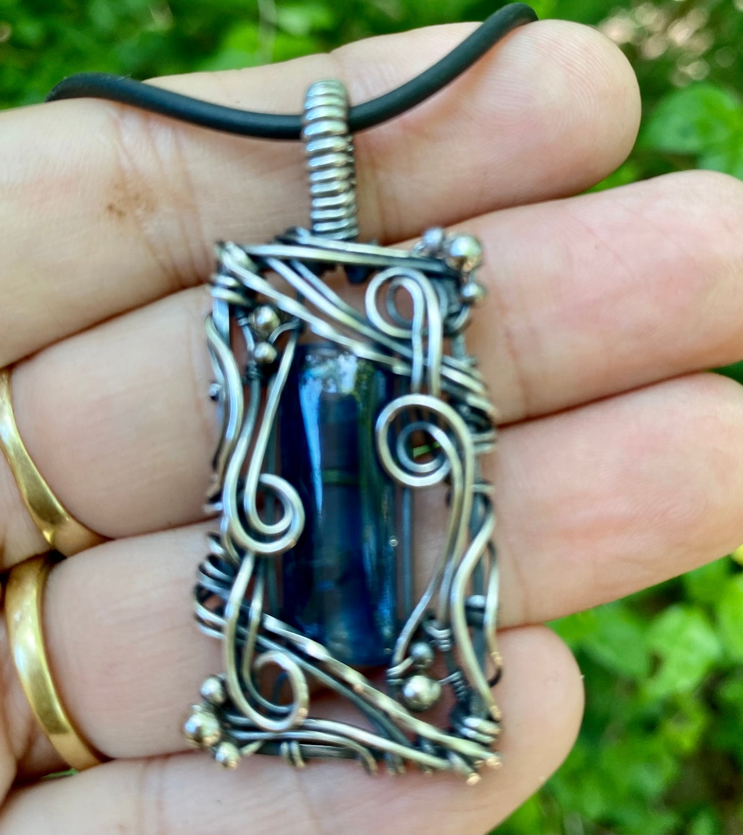 Blue Kyanite and Sterling Silver wire wrap pendant.