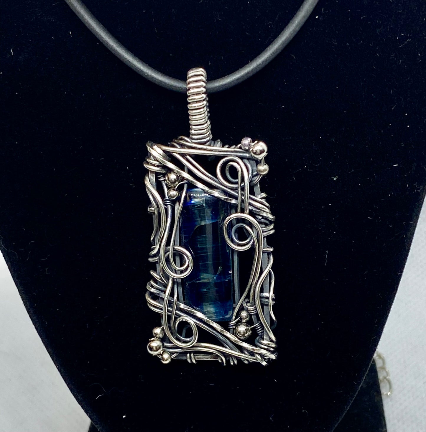 Blue Kyanite and Sterling Silver wire wrap pendant.