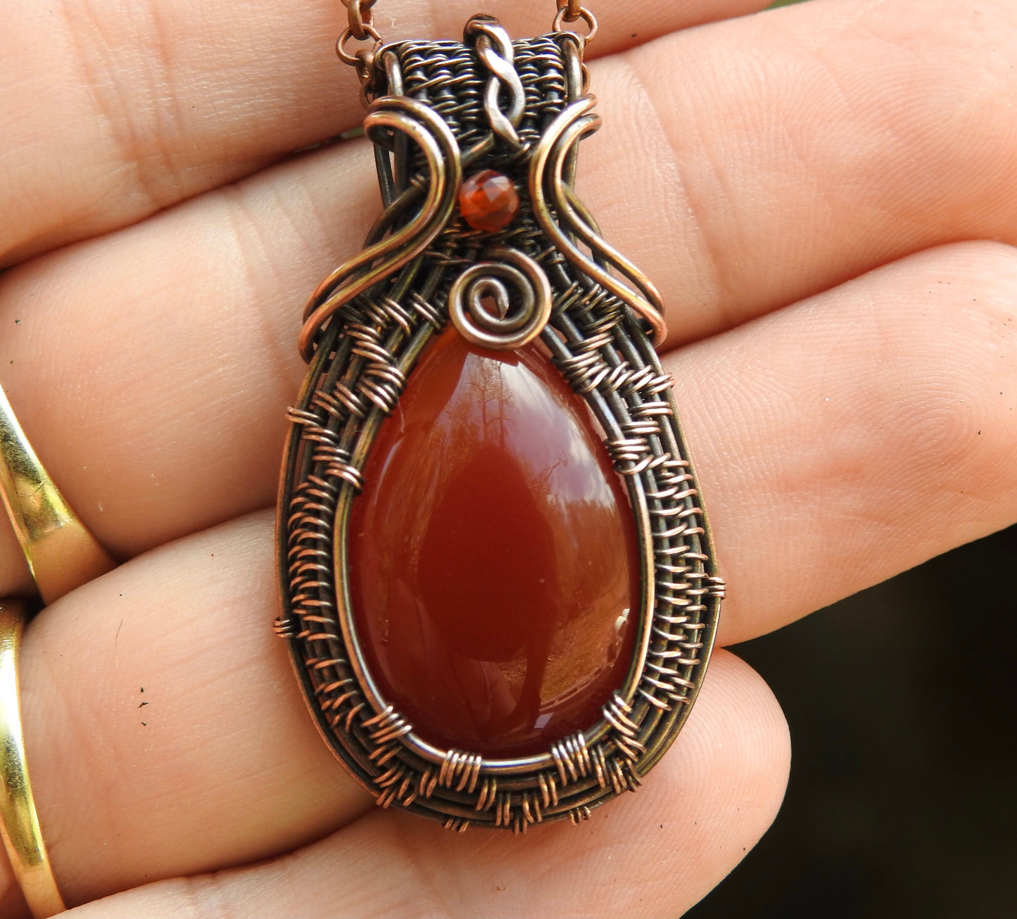 handmade carnelian and natural copper wire wrap pendant.